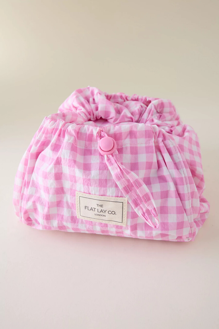 bolsa de maquillaje con cordón y diseño de paracaídas de the flat lay co.