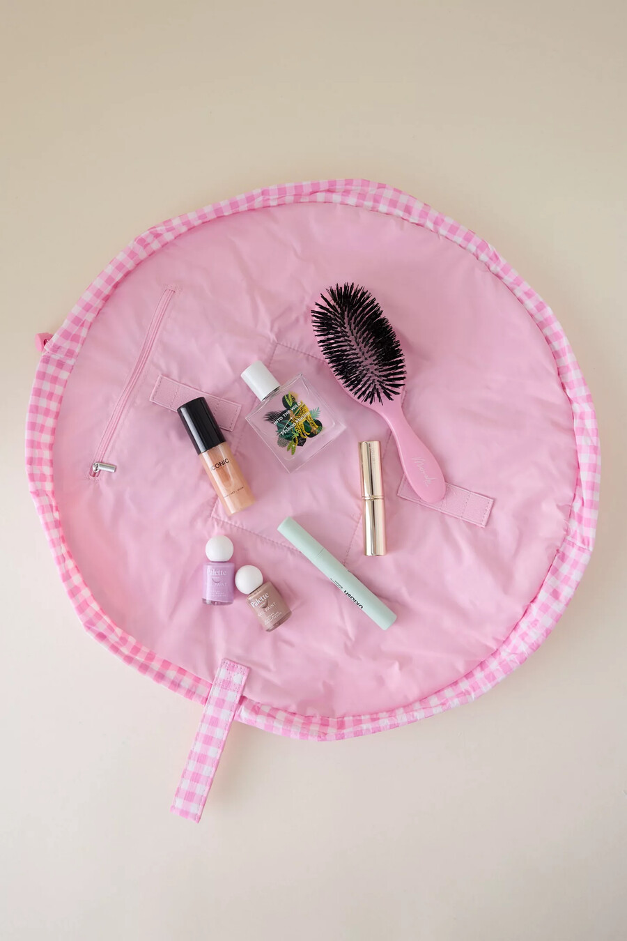 bolsa de maquillaje con cordón y diseño de paracaídas de the flat lay co.